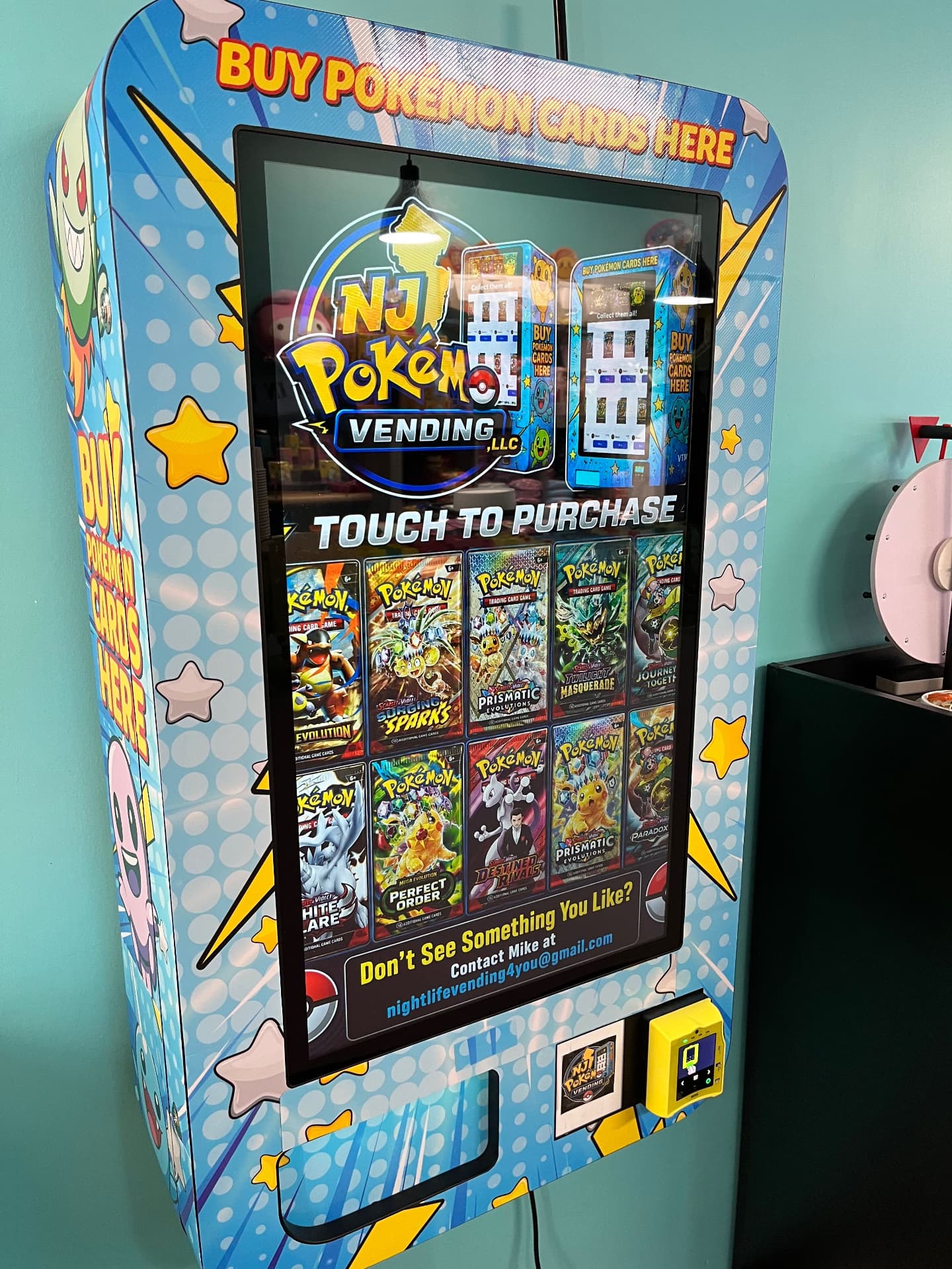 Close-up of a Pokémon card vending machine touchscreen inside a store