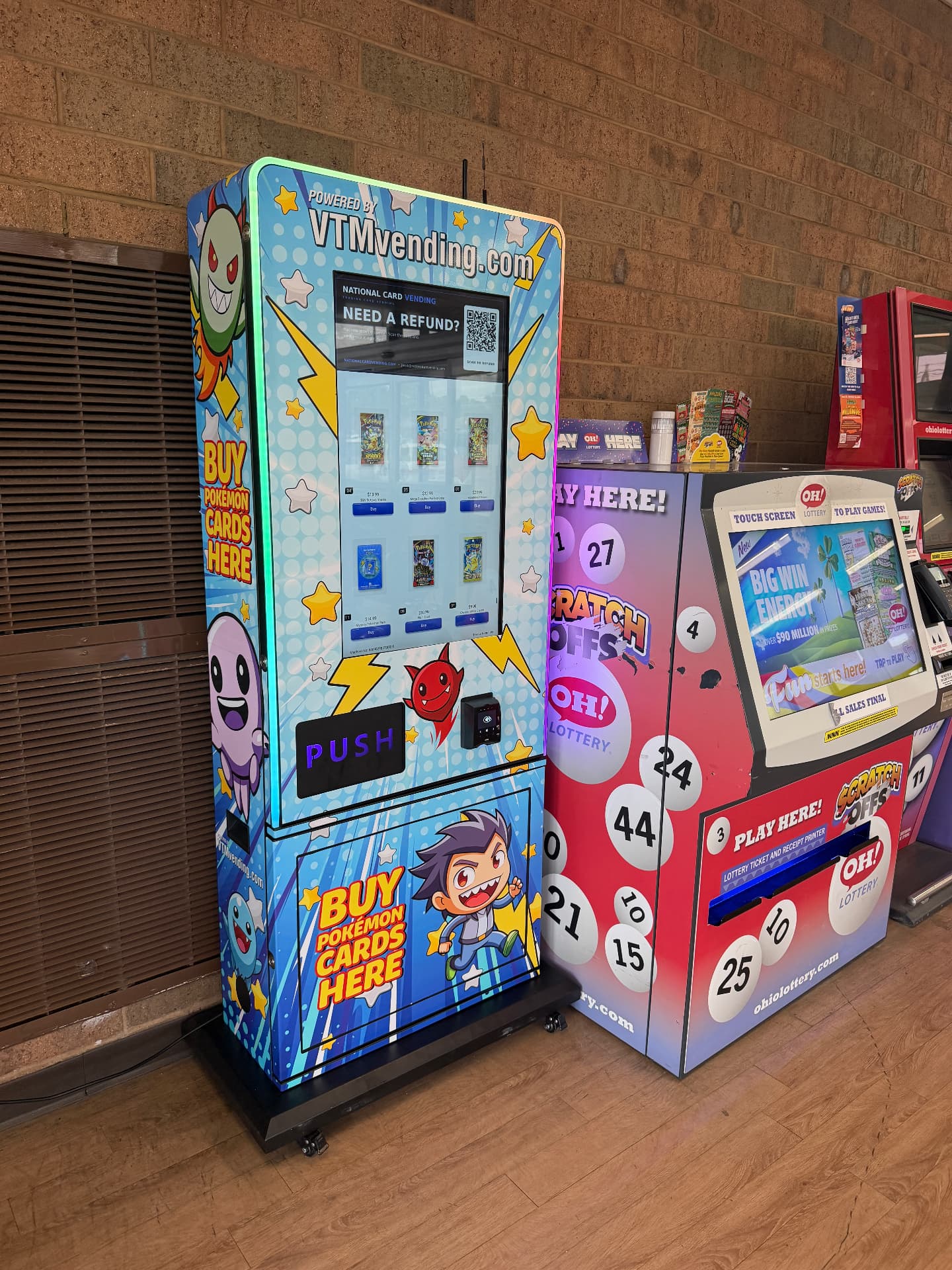 Pokémon card vending machine with LED edge lighting next to a lottery kiosk